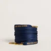 Cordones de algodón azul con logotipo dorado en contraste