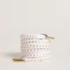 Cordones de algodón blanco con estrellas doradas en contraste