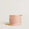 Cordones de algodón rosa con estrellas doradas en contraste