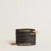 Cordones de lurex gris oscuro con logotipo dorado en contraste
