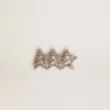 Accesorio de cordones con tres estrellas color oro antiguo con cristales