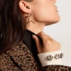 Aretes colgantes para mujer «Star» en color oro antiguo