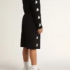 Bermudas negras para niños con estrellas blancas
