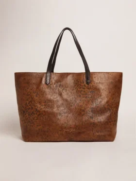 Bolso Pasadena de cuero martillado con estampado de leopardo y asas negras en contraste