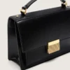 Bolso Venezia en cuero negro con detalles dorados