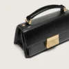 Bolso Venezia pequeño en cuero negro con detalles dorados