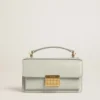 Bolso Venezia pequeño en piel repujada gris mineral con detalles dorados