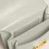 Bolso Venezia pequeño en piel repujada gris mineral con detalles dorados