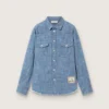 Camisa unisex Journey de cambray de algodón azul claro con dobladillo con flecos y parche bordado
