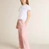 Camisas blancas y plateadas con logotipo y estrella grande en purpurina plateada