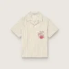 Camisas de niños a rayas en color crudo, beige y gris con bordado «Frutteria Golden»