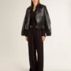 Camisas negras para mujer con rayas verticales y cierre con nudo lateral