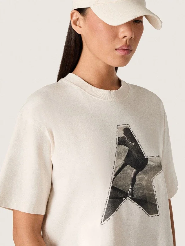 Camiseta de mujer en jersey de algodón blanco con estampado de estrellas