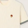 Camiseta de punto blanca para mujer con bordes en contraste y broche desmontable