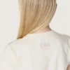 Camiseta para niñas «Star» en jersey de algodón blanco con estrella rosa brillante