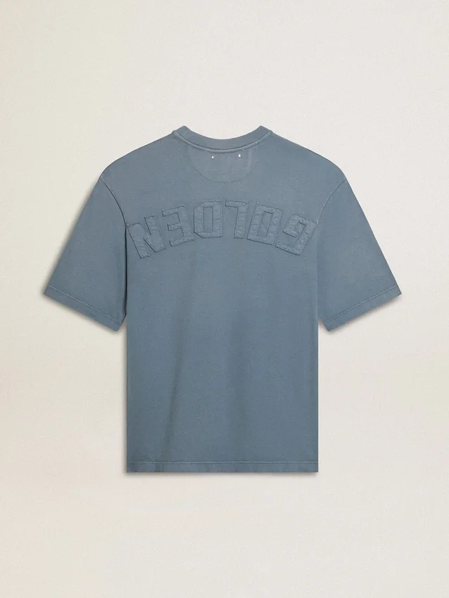 Camiseta unisex de algodón en azul claro con estampado invertido en la espalda