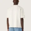 Camiseta unisex de la colección Resort, de algodón blanco con estampado y logotipo