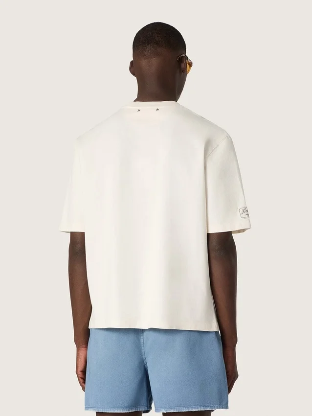 Camiseta unisex de la colección Resort, de algodón blanco con estampado y logotipo