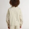 Chaqueta beige para niños con salpicaduras multicolores