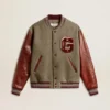 Chaqueta bomber de lana gris jaspeada con mangas de cuero