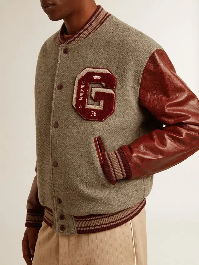 Chaqueta bomber de lana gris jaspeada con mangas de cuero