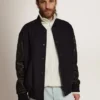 Chaqueta bomber para hombre de lana azul oscuro con mangas de cuero