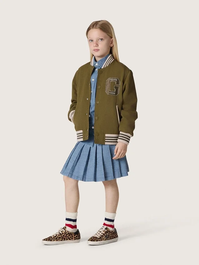 Minifalda plisada para niñas «Journey» en chambray de algodón azul claro con logotipo bordado