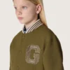 Chaqueta bomber unisex Journey en sarga de nailon verde militar con parche bordado