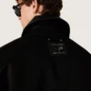 Chaqueta corta acolchada para hombre en algodón negro con cuello de cuero