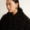 Chaqueta de piel de oveja negra para mujer