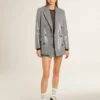 Chaqueta tipo «boyfriend» de lana con doble botonadura, en microcuadros de pata de gallo y lentejuelas