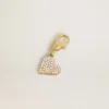 Colgante en forma de corazón de latón dorado con cristales