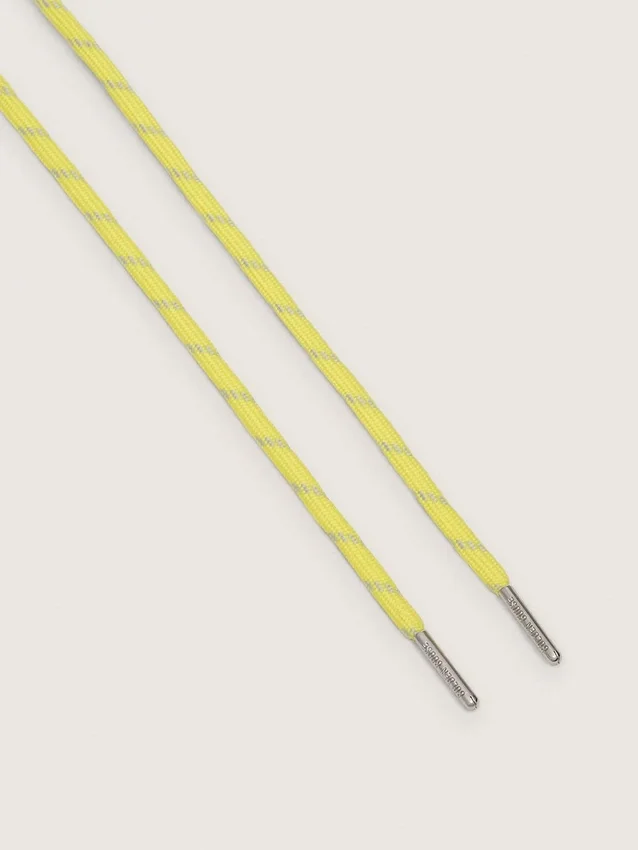 Cordones amarillos para tenis con detalles en gris