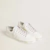 Cordones de algodón blanco con estrellas doradas en contraste