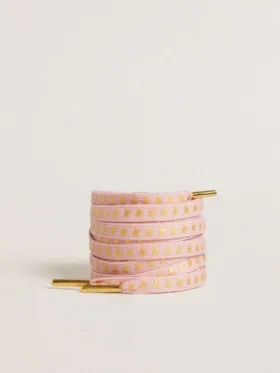 Cordones de algodón rosa con estrellas doradas en contraste
