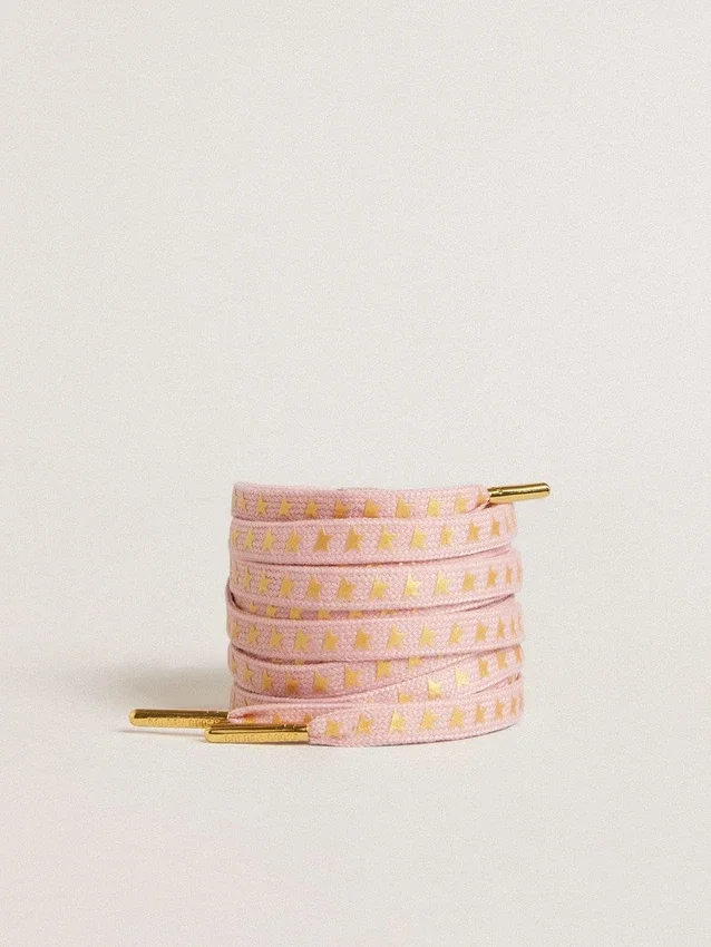 Cordones de algodón rosa con estrellas doradas en contraste