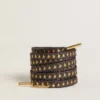 Cordones de lurex gris oscuro con estrellas doradas en contraste