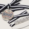 Cordones de pieles a rayas color crema y azul oscuro con broche y apliques plateados