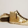 Francy Penstar en brillo dorado con estrella de cuero blanco