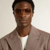 Gafas de sol estilo aviador con marco dorado y lentes beige