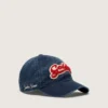 Gorra de béisbol azul denim con parche «Golden» de felpa roja y blanca
