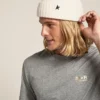 Gorro de lana blanco con estrella negra