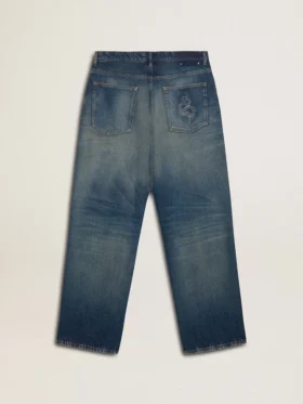 Jeans de corte holgado y lavado medio para hombre CNY