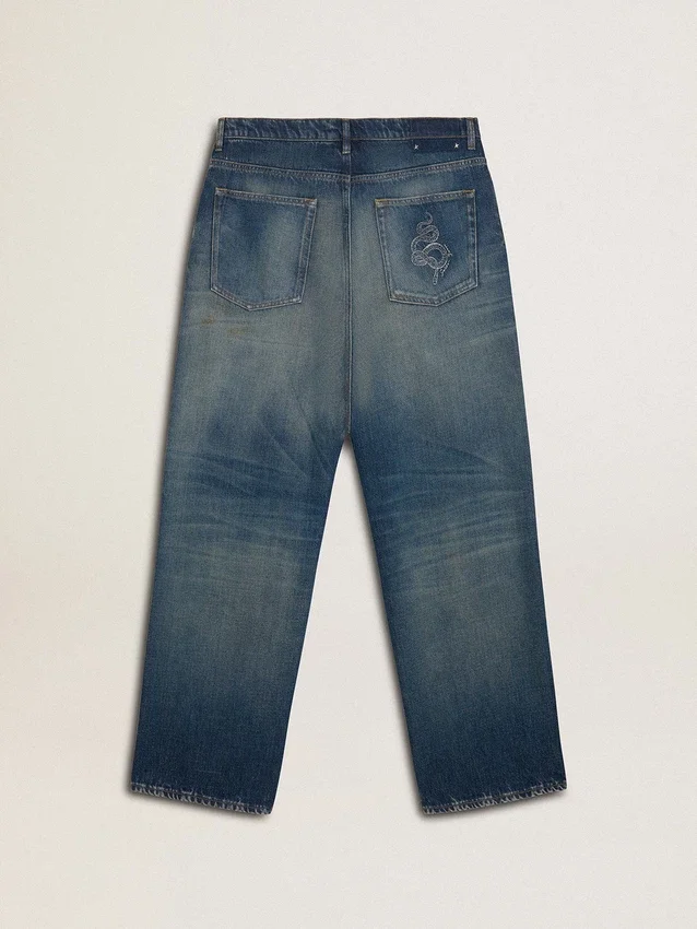 Jeans de corte holgado y lavado medio para hombre CNY