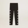 Leggings negros para niñas con estrellas blancas en los costados