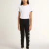 Leggings negros para niñas con estrellas blancas en los costados