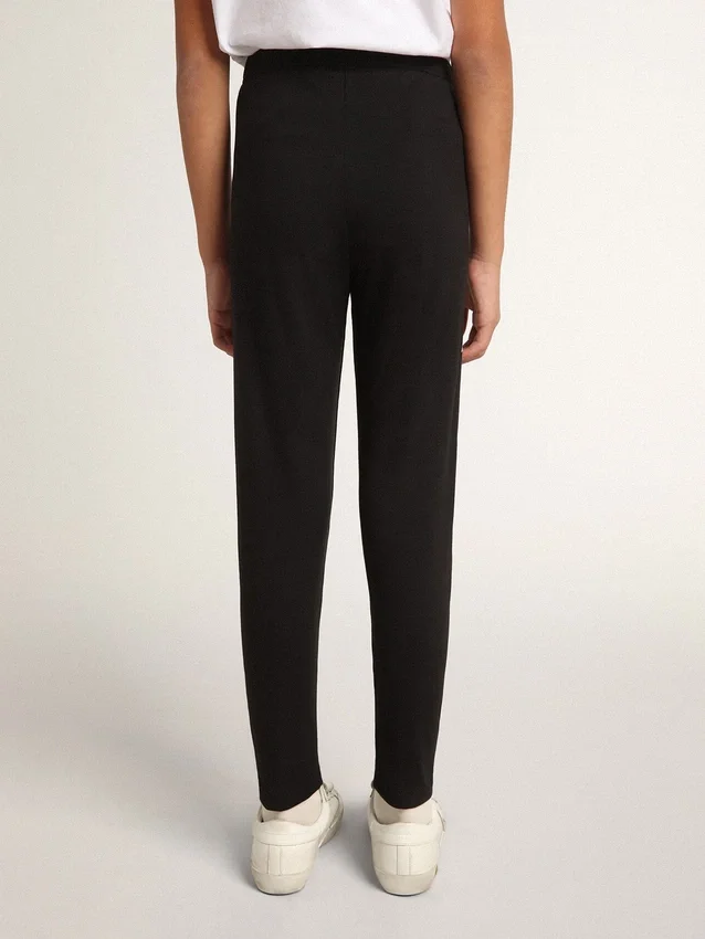 Leggings negros para niñas con estrellas blancas en los costados