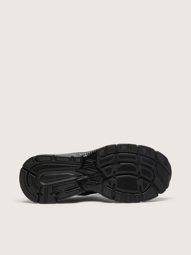 Lightstar para mujer con parte superior de cuero negro y malla y estrella negra