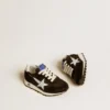 Marathon Junior en nylon negro con estrella impresa y lengüeta de cuero en el talón