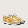 Marathon para mujer con parte superior de nylon amarillo y estrella naranja